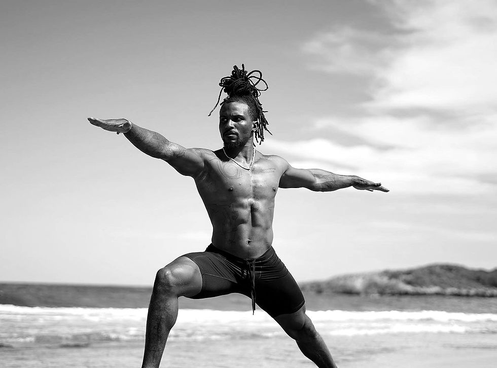 DJ Townsel in warrior pose on the beach